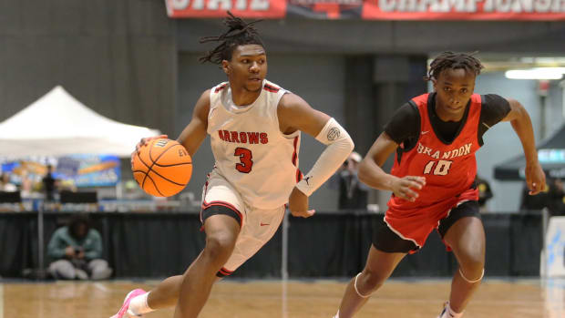 Clinton Arrows star Trey Alexander (3) drives to the basket against the Brandon Bulldogs in the MHSAA Class 7A Semifinals on Thrusday, Feb. 29, 2024 at the Mississippi Coliseum in Jackson.